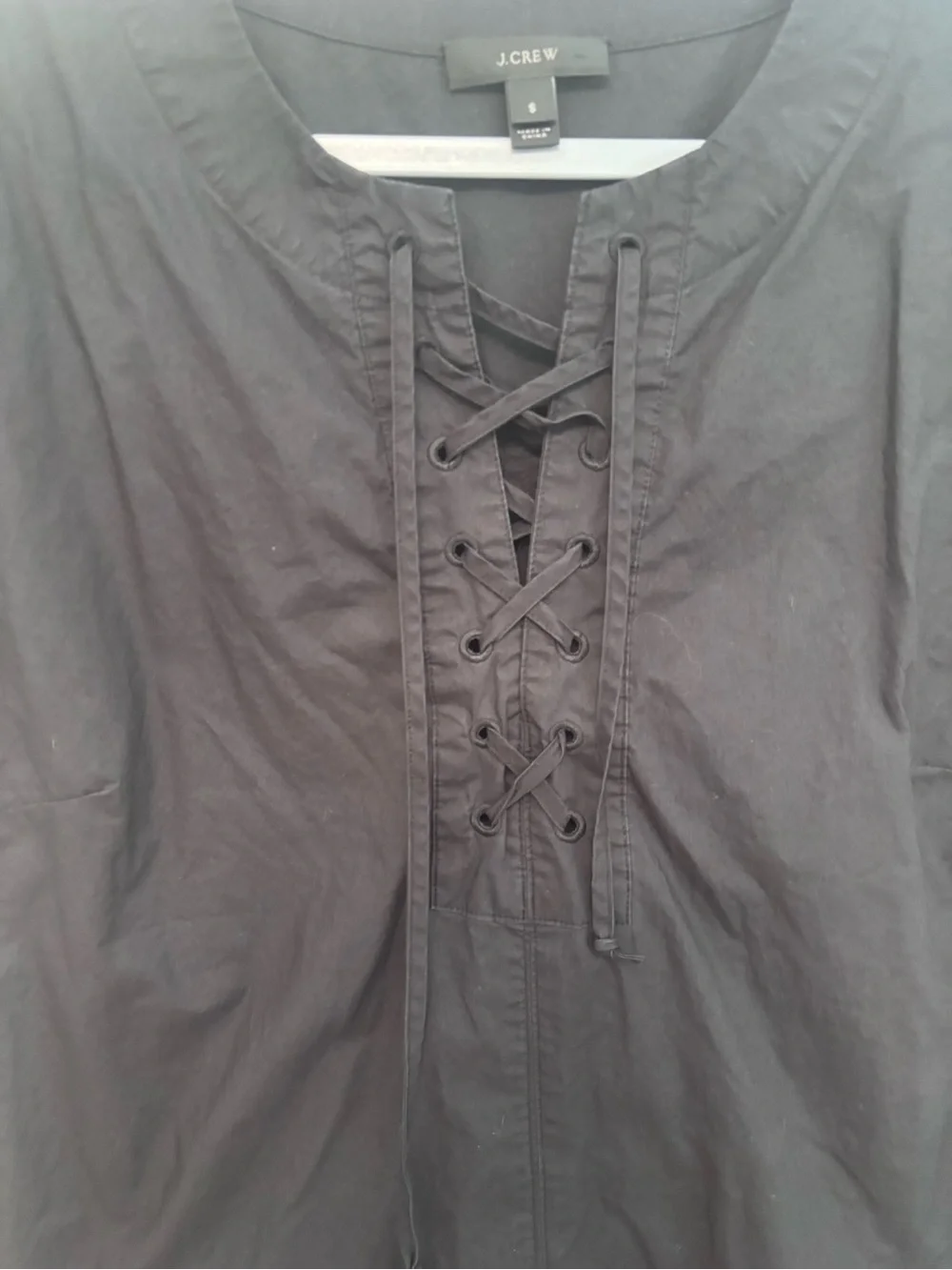 J Crew black short sleeved lace up dress.